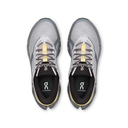 A pair of On Cloudrunner running shoes shown from a top-down view, featuring a light gray and white mesh upper with black and gray soles, black interiors, and gold accents on the laces and heel trim.