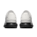 A pair of white athletic shoes shown from the back, featuring textured white uppers and thick black midsoles, set against a plain white background.