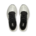 White running shoes with black soles on a white background
