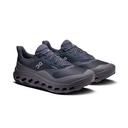 A pair of dark gray and navy blue On running shoes with a chunky, cushioned sole, displayed on a clean white background.