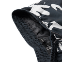 Close-up of black and white camouflage shorts with mesh lining on a white background