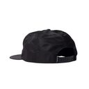 Black flat-brim snapback cap shown from the back, featuring a black adjustable strap with a small white brand logo on the side, set against a plain white background.