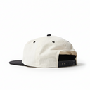 White cap with black visor on a white background