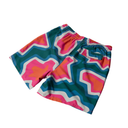 Colorful geometric patterned shorts on a white background