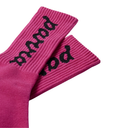 A pair of bright pink ribbed crew socks with the word 'pursue' knitted in black gothic-style lettering on the cuffs, shown against a plain white background.