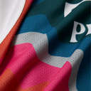 Close-up of colorful fabric with geometric patterns and brand logo.