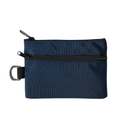 A dark navy blue nylon pouch with a top zipper, a horizontal black zipper, and a black strap with a silver metal D-ring, shown on a plain white background.