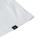 White pillow with a black label on a white background