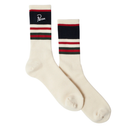 A pair of off-white crew socks with navy, red, and white stripes near the cuff. One sock features a black cuff panel with the brand name 'Pisa' in white script.