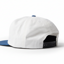 White cap with blue visor and black interior on a white background