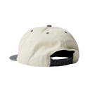Beige cap with black accents on a white background