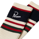 A pair of ribbed knit crew socks with cream, navy, red, and dark green horizontal stripes, featuring an embroidered white script logo on the navy section.