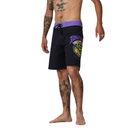 Person wearing black shorts with a colorful graphic design on a white background