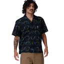 Man wearing a patterned shirt with a plain background