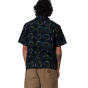 Person wearing a black patterned shirt on a white background