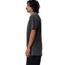 Person wearing a dark acid-wash t-shirt on a white background