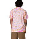 Person wearing a tie-dye t-shirt with pink and orange patterns on a white background