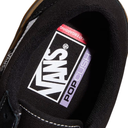Close-up of a Vans shoe with 'Pop Cush' label on a white background