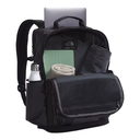Black backpack with laptop, water bottle, and towel on a white background