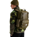Person wearing a camouflage jacket and green backpack with The North Face logo on a white background