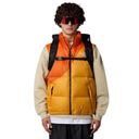 Person wearing a two-tone orange and yellow puffer vest with a black backpack on a white background