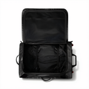 An open black hard-shell suitcase shown from a top-down view, revealing a spacious black interior with a mesh pocket in the lid, compression straps, and a telescoping handle on a white background.