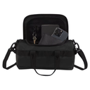 A black duffel-style shoulder bag shown open against a plain white background, with a phone, wallet, and keys visible inside the compartments.