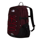 A The North Face backpack in burgundy and black, featuring red lacing on the front, a top carry handle, and a side mesh pocket, shown against a plain white background.