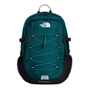 The North Face Karrag backpack in teal green and black, featuring a front zippered pocket with the white brand logo, adjustable lacing system, and side mesh pockets, shown against a plain white background.