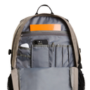 Open gray backpack showing interior organization with multiple pockets, a phone, a pen, and an orange notebook inside, on a white background.