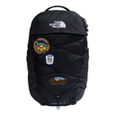 A black The North Face Boralis backpack with multiple embroidered patches on the front, set against a plain white background.