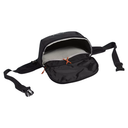 A black nylon waist bag shown open against a white background, featuring a gray interior lining, an orange zipper pull, and adjustable black webbing straps with metal buckles.