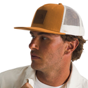 Man wearing a brown and white cap with a visible brand logo on a white background