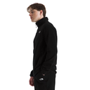 A man in profile wearing a black fleece pullover and matching black pants with a small white The North Face logo on the chest and thigh, photographed against a plain white background.