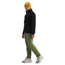 Person wearing a black jacket, green pants, and a yellow beanie on a white background