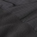 Close-up of a dark charcoal gray fabric product showing a stitched seam between a fine grid-patterned section and a plush fleece-like section.