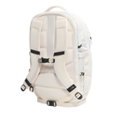 The back view of a light cream/off-white technical backpack with padded shoulder straps, black adjustment buckles, and a top carry handle, shown on a solid white background.
