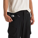 Black cargo pants with The North Face logo on a white background