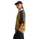 Person wearing a green t-shirt with a logo and a black cap on a white background