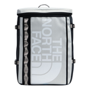 The North Face insulated backpack in white, black, and silver, featuring a large vertical logo on the front, black zippers, and silver buckles, shown against a plain white background.