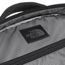 Close-up of a The North Face bag with a grid pattern and black zipper.