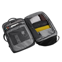 Open travel bag with compartments on a white background