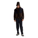 A model wearing a dark brown and navy fleece jacket, dark navy sweatpants, a dark brown beanie, and sunglasses, standing against a solid white background.