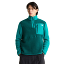 A man wearing a teal fleece pullover with a half-zip collar and a chest pocket, photographed against a plain white background.