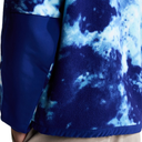 Close-up of a fleece jacket with a blue and white tie-dye pattern, featuring a solid dark blue sleeve and hem.