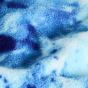 A close-up of a plush, fuzzy fabric with a blue and white tie-dye pattern.