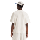 Person wearing a white mesh outfit with a cap on a white background
