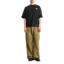 Person wearing a black t-shirt and beige pants on a white background