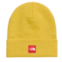 A yellow ribbed knit beanie hat with a folded cuff and a red square patch featuring the white logo of The North Face.