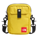 A yellow The North Face crossbody phone bag with a black strap, black snap closure, and a red brand patch on the front, shown on a white background.